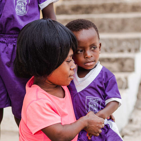 An African mother in Ghana holds her young son